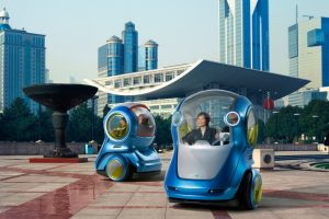 Networked Cars  General Motors' EN-V is a two-seat driverless electric vehicle that communicates its speed, location and availability with other cars in its network via Wi-Fi